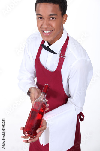 Photo: Waiter presenting bottle of wine Waiter presenting bottle of wine