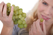 woman eating grapes