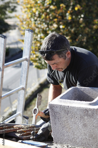 Photo: Roofer hard at work Roofer hard at work