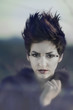 Beautiful woman with short hair and makeup cosmetics