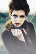 Beautiful woman with short hair and makeup cosmetics