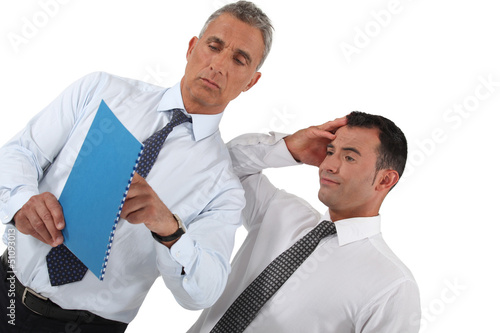 Photo: Businessmen looking at document Businessmen looking at document