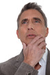 Senior businessman musing