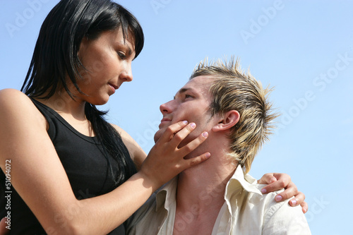 Photo: woman about to kiss a man woman about to kiss a man