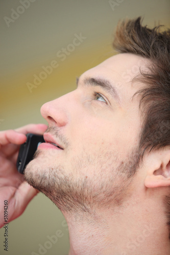 Photo: Close-up of man on mobile telephone Close-up of man on mobile telephone