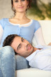 Man on his girlfriend's lap