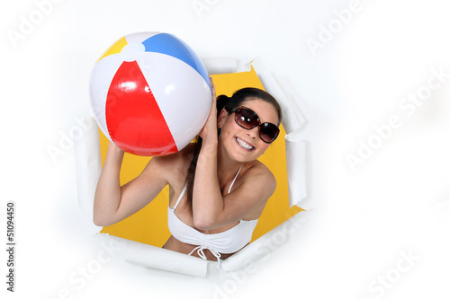 Photo: Woman in bikini with an inflatable ball. Woman in bikini with an inflatable ball.
