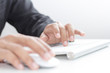 Hands working on the keyboard