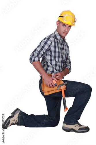 Photo: Builder kneeling Builder kneeling