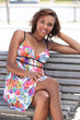 Brunette woman sitting on a bench