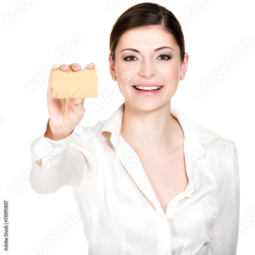 Photo: Portrait of smiling woman in a white shirt with credit card Portrait of smiling woman in a white shirt with credit card
