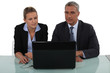 A team of business professionals reading an e-mail