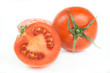 Tomatoes with green leaves isolated on white background