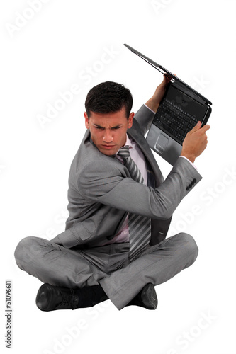 Photo: Man about to smash laptop Man about to smash laptop