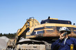 giant bulldozer and construction worker