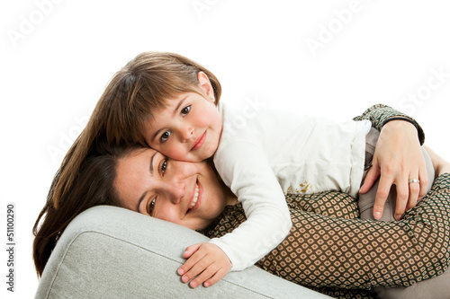 Photo: Mother and daughter on couch. Mother and daughter on couch.