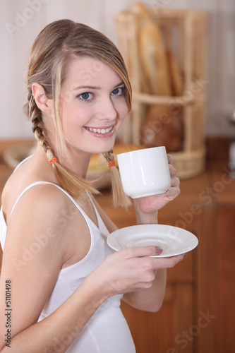 Photo: Woman drinking coffee Woman drinking coffee