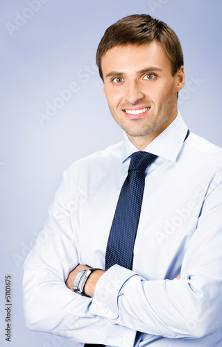 Photo: Portrait of businessman, over violet Portrait of businessman, over violet