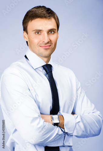 Photo: Portrait of businessman, over violet Portrait of businessman, over violet