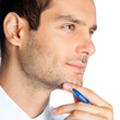 Portrait of thinking businessman, on white