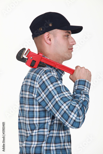 Photo: Builder carrying wrench Builder carrying wrench