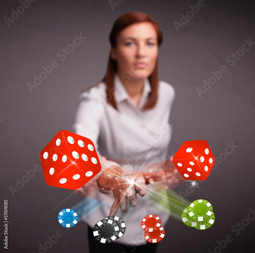 Photo: Young woman throwing dices and chips Young woman throwing dices and chips