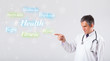 Clinical doctor pointing to health and fitness collection of wor