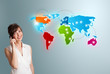 young woman making phone call with colorful world map