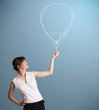 Beautiful woman holding balloon drawing