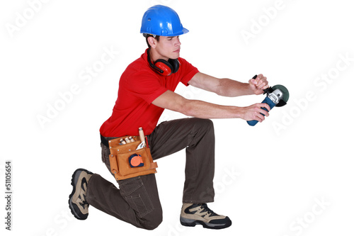 Photo: craftsman holding an electric saw craftsman holding an electric saw