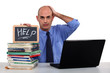 Man with a laptop asking for help