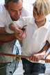 Foto: Father and son with a crab Father and son with a crab