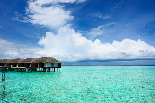 Photo: Beautiful beach with water bungalows Beautiful beach with water bungalows
