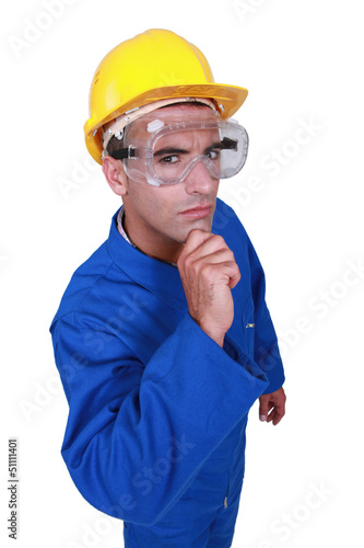 Photo: A dubious construction worker. A dubious construction worker.