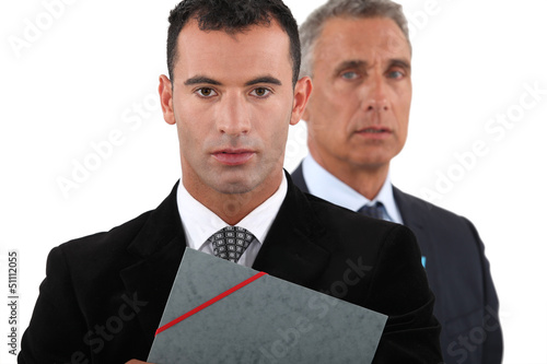 Photo: Two businessmen with folder Two businessmen with folder