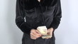 black shirt woman with big pile of banknotes