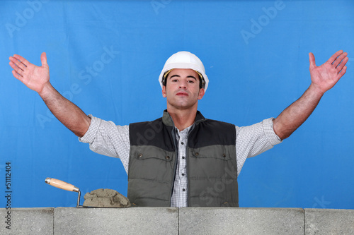 Photo: A mason with open arms. A mason with open arms.