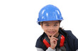 Young girl pretending to be a construction worker