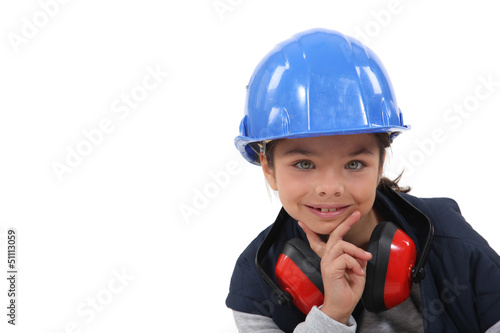 Photo: Young girl pretending to be a construction worker Young girl pretending to be a construction worker