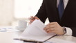 man signing a contract