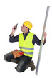 craftsman holding a walkie talkie