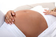 Woman stroking pregnant belly