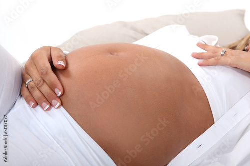 Photo: Woman stroking pregnant belly Woman stroking pregnant belly