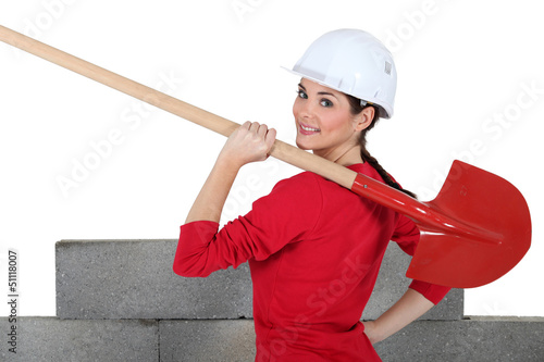 Photo: Female construction worker with a shovel Female construction worker with a shovel