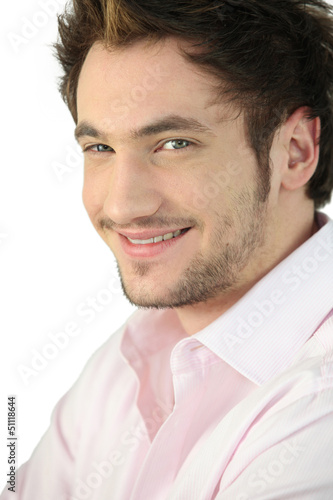 Photo: Portrait of a young man smiling Portrait of a young man smiling