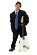 Boy in loose fitting suit stood with electric guitar