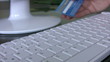 Woman confirming credit card data for e-commerce.