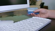 Woman confirming credit card data for e-commerce.