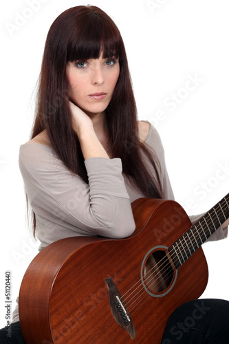 Photo: Woman with guitar Woman with guitar