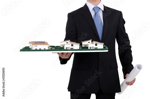 Photo: Architect holding scale model of housing Architect holding scale model of housing